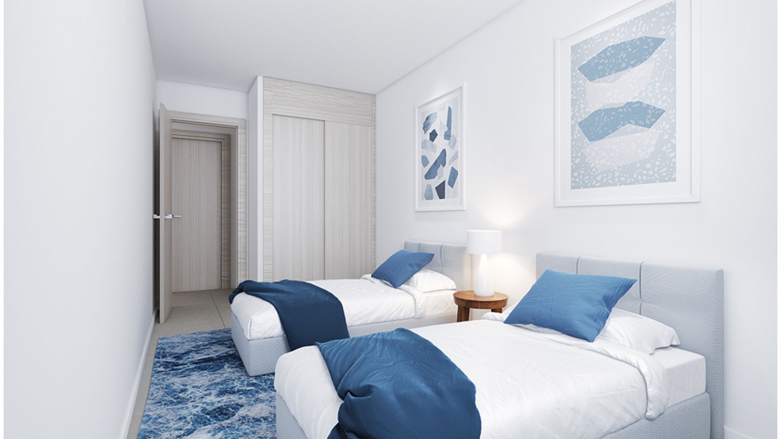 Moderne slaapkamer met twee eenpersoonsbedden en blauwe accenten